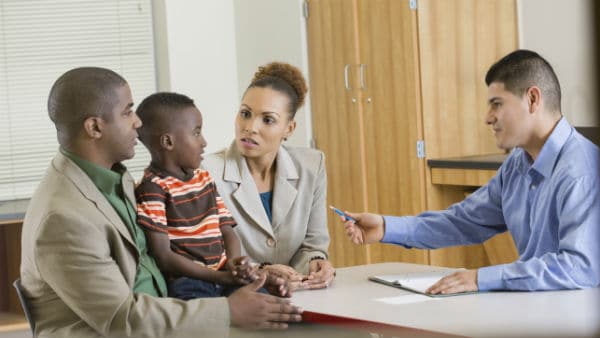 Principal talking with parents and student